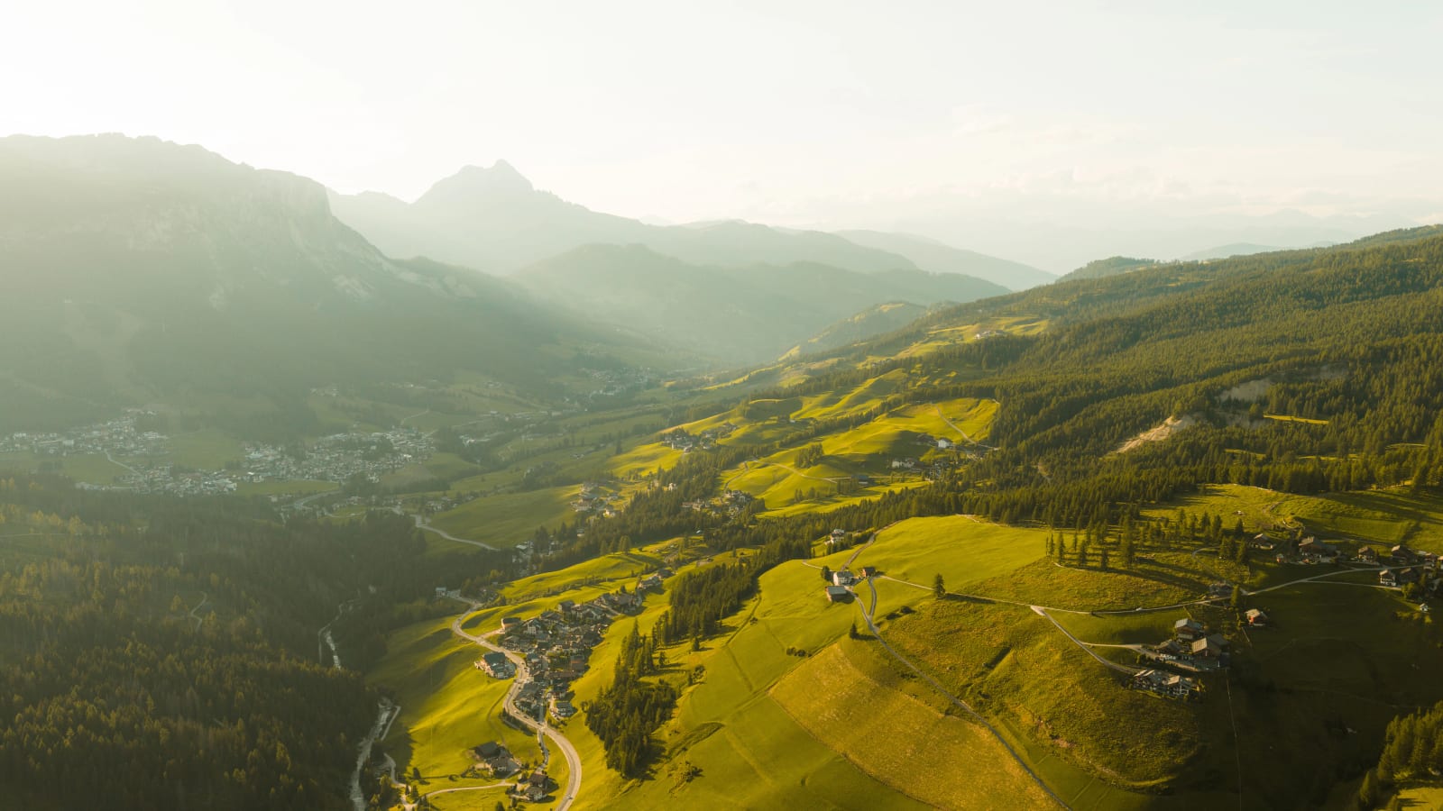 San Cassiano from above: the valley floor, meadows and woods of Alta Badia. Photograph by Luca Canins.